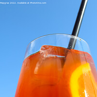 Buy canvas prints of Refreshing orange summer cocktails with ice against a blue sky b by Michael Piepgras
