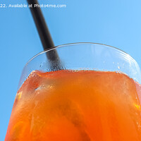 Buy canvas prints of Refreshing orange summer cocktails with ice against a blue sky b by Michael Piepgras