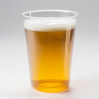 Buy canvas prints of Glass of beer in a plastic tumbler on a white background created by Michael Piepgras