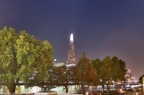 View of the London skyline at night with river thamse and lots of light Picture Board by Michael Piepgras