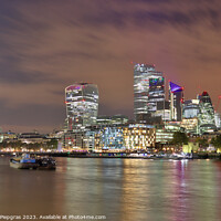 Buy canvas prints of View of the London skyline at night with river thamse and lots of light by Michael Piepgras