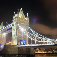 Buy canvas prints of The Tower Bridge in London at night with colorful lights by Michael Piepgras