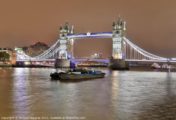 The Tower Bridge in London at night with colorful lights Picture Board by Michael Piepgras
