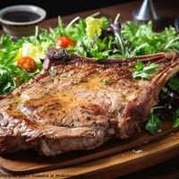 Buy canvas prints of Tasty T Bone steak on a plate with some salad created with gener by Michael Piepgras