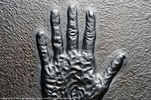 Metal surface background with the relief imprint of a human hand Picture Board by Michael Piepgras