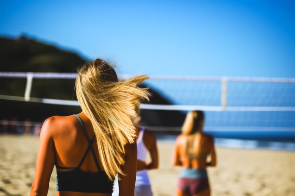 Attractive women playing beach volleyball on a sunny day. Picture Board by Michael Piepgras