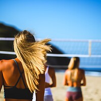 Buy canvas prints of Attractive women playing beach volleyball on a sunny day. by Michael Piepgras