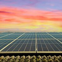 Buy canvas prints of Solar panels producing clean energy on a roof of a residential house during sunset. by Michael Piepgras