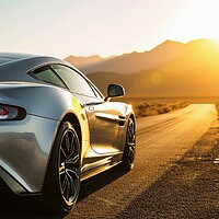 Buy canvas prints of A fast sports car with silver paintwork drives along a lonely ro by Michael Piepgras