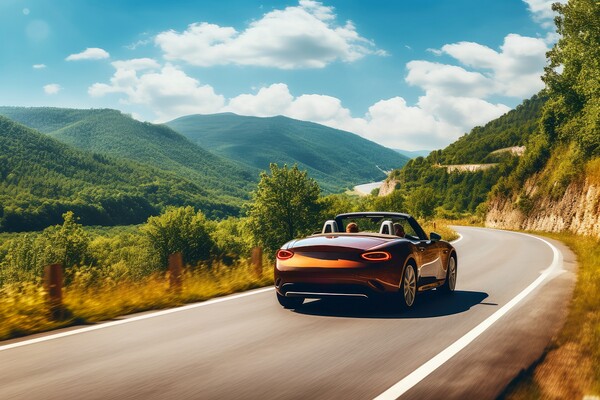 A summer day in a beautiful convertible on a winding road. Picture Board by Michael Piepgras