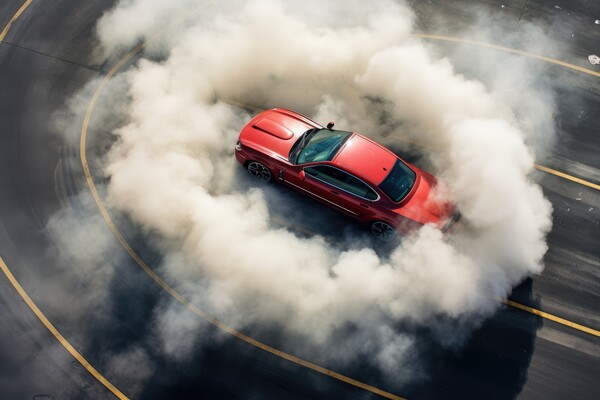 Aerial view of a sports car making donuts. Picture Board by Michael Piepgras