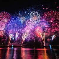 Buy canvas prints of An impressive happy new year fireworks. by Michael Piepgras