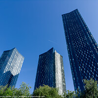Buy canvas prints of Manchester city centre glass buildings with blue sky by Samuel Foster