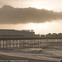 Buy canvas prints of Brighton Pier on a stormy windy day with sun coming through clouds by Samuel Foster