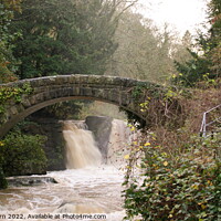 Buy canvas prints of A stone bridge over a river by Richard Fairbairn