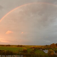 Buy canvas prints of Rainbow over Blakeney Marshes by Nick Unitt