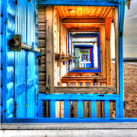 Buy canvas prints of Looking through the beach huts by Robin Clarke