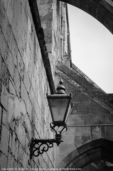 Old Lamp on Winchester Catherdral Wall Picture Board by Stephen Young