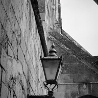 Buy canvas prints of Old Lamp on Winchester Catherdral Wall by Stephen Young