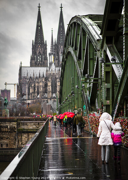 Rainy Day Crossing the Hohenzollern Bridge, Cologne, Germany Picture Board by Stephen Young