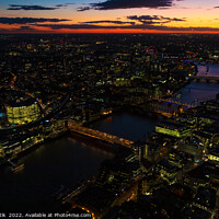 Buy canvas prints of Aerial illuminated London city the financial business center  by Spotmatik 