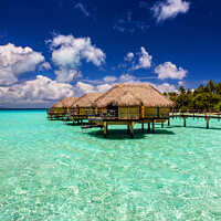 Buy canvas prints of Bora Bora Island Overwater luxury resort Bungalows Polynesia by Spotmatik 
