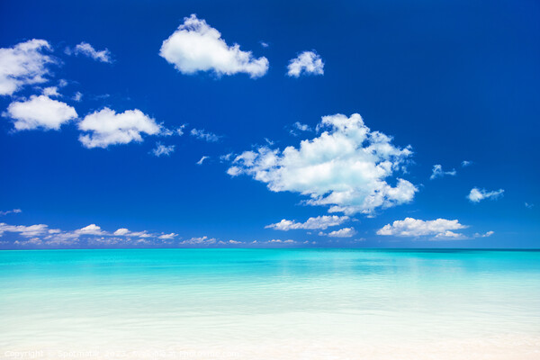 View of blue ocean and white sandy beach Picture Board by Spotmatik 