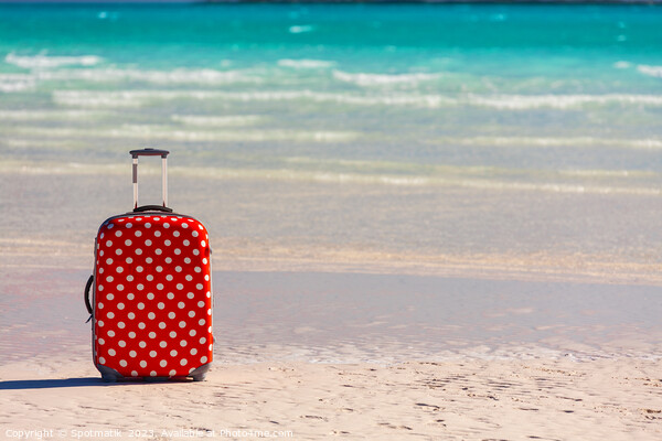 Red polka dot travel luggage on sand beach Picture Board by Spotmatik 