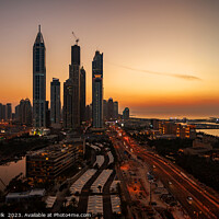 Buy canvas prints of Dubai sunset Sheikh Zayed Road Media city skyscrapers  by Spotmatik 