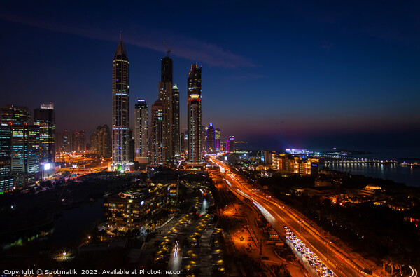 Dubai dusk illuminated view Sheikh Zayed city skyscrapers  Picture Board by Spotmatik 