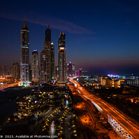 Buy canvas prints of Dubai dusk illuminated view Sheikh Zayed city skyscrapers  by Spotmatik 