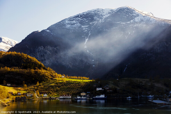 Norwegian sunlight beaming though light mist glacial fjord  Picture Board by Spotmatik 