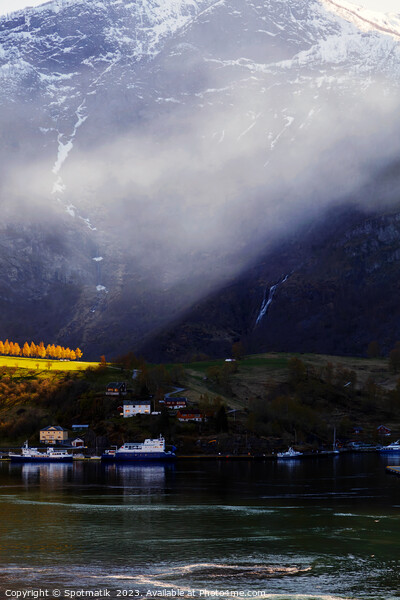 Sunlight beaming though light mist Norwegian glacial fjord  Picture Board by Spotmatik 