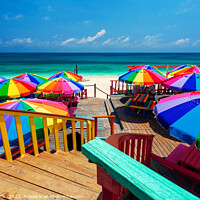 Buy canvas prints of Beach umbrellas in the tropical sunshine Bahamas Caribbean by Spotmatik 