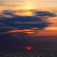Buy canvas prints of Sunset dusk view of setting sun ocean horizon  by Spotmatik 