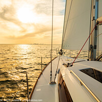 Buy canvas prints of Sailing private yacht towards city skyline at sunrise by Spotmatik 