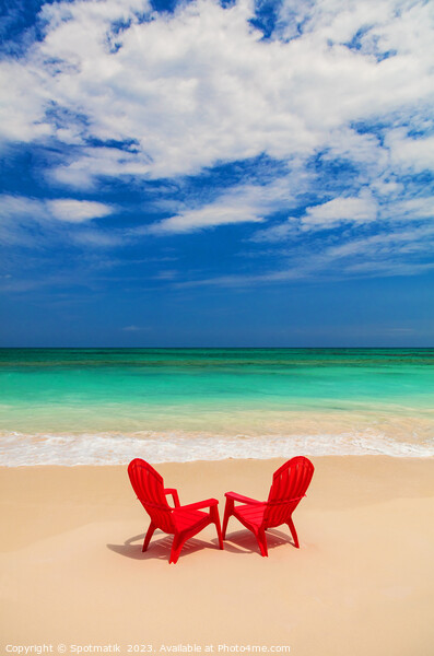 Red chairs on sandy beach by ocean Bahamas Picture Board by Spotmatik 