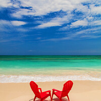 Buy canvas prints of Red chairs on sandy beach by ocean Bahamas by Spotmatik 
