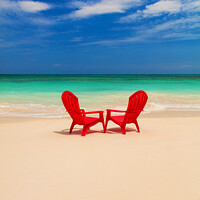 Buy canvas prints of Tranquil holiday destination with red chairs on beach by Spotmatik 
