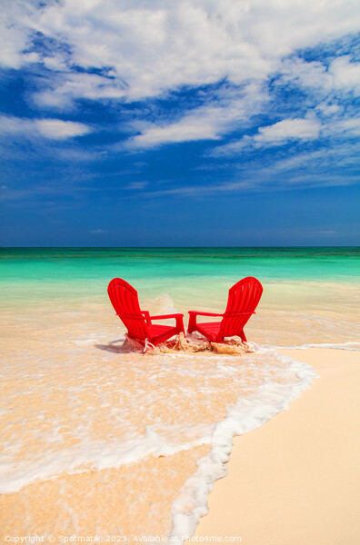 Red chairs on shoreline of sandy beach Bahamas Picture Board by Spotmatik 
