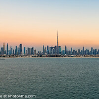 Buy canvas prints of Aerial Panoramic sunset view of Dubai city skyscrapers  by Spotmatik 