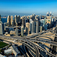 Buy canvas prints of Aerial Dubai city skyscrapers modern highway interchange UAE by Spotmatik 