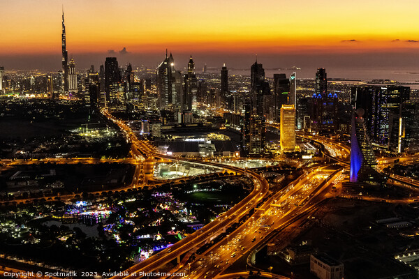 Aerial view of illuminated Dubai at sunset UAE  Picture Board by Spotmatik 