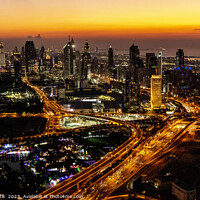 Buy canvas prints of Aerial view of illuminated Dubai at sunset UAE  by Spotmatik 