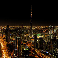 Buy canvas prints of Aerial Dubai illuminated night view of Burj Khalifa  by Spotmatik 