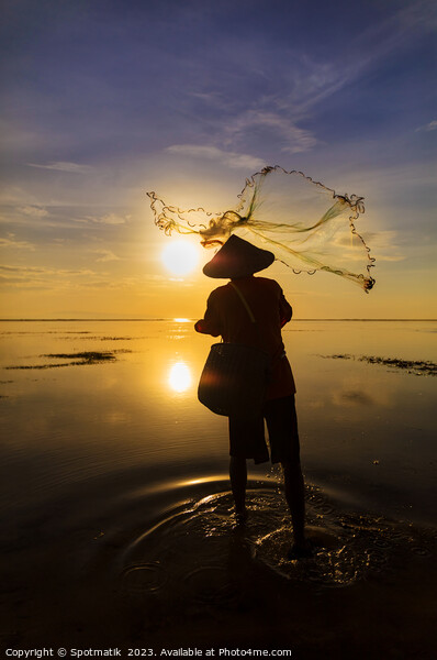 Balinese fisherman casting net Flores sea sunrise Picture Board by Spotmatik 