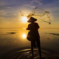 Buy canvas prints of Balinese fisherman casting net Flores sea sunrise by Spotmatik 