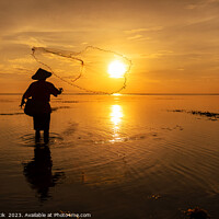Buy canvas prints of Silhouette Balinese male fishing Indonesian coastline at sunrise by Spotmatik 
