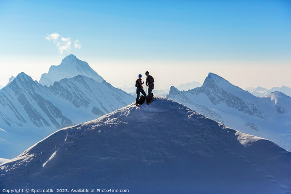 Aerial Switzerland two climbers on snow covered Peak Picture Board by Spotmatik 