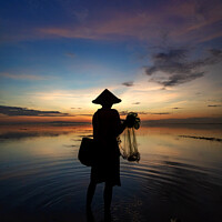 Buy canvas prints of Balinese male fishing at sunrise Flores sea coastline  by Spotmatik 